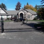 custom steel swing gate with capital letter decor