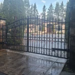 Electric gate with elegant wrought iron design